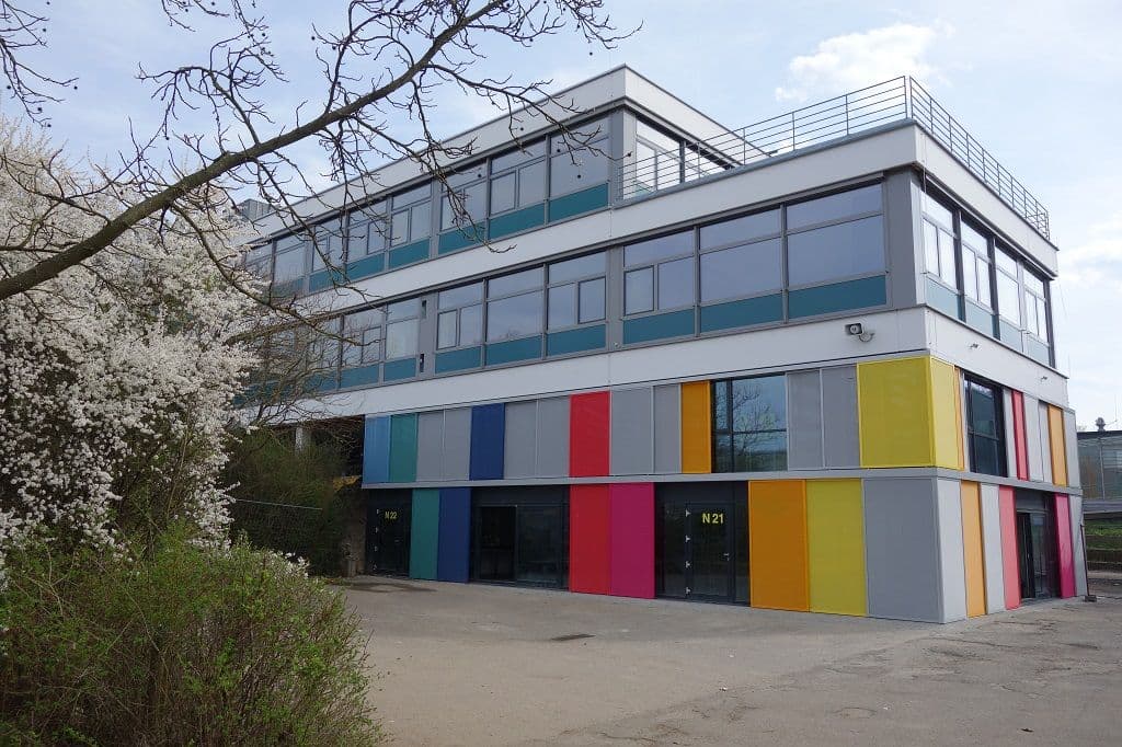 a large building with a lot of windows and colorful walls .